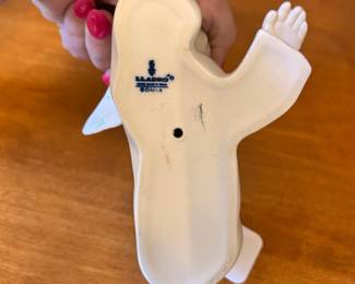 R176 - $15. Lladro "Angel Laying Down". Measures 5.5" long