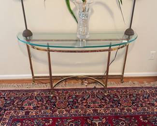 R27 - $200. Vintage Ethan Allen Brass Console Table with glass table. Measures 53.5" wide x 16" deep x 28" tall.