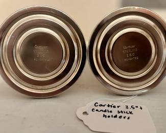 R136 - $60. Cartier Sterling Weights Candle Stick Holders $160. Measures 3.5" tall.