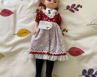 R90 - $12. Effanbee Sleepy Eye Floral Prairie Doll.