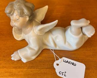 R176 - $15. Lladro "Angel Laying Down". Measures 5.5" long