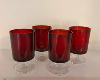 R121 - $30. Set of 4 Ruby Red Wine Goblets. Measures 4.5" tall.