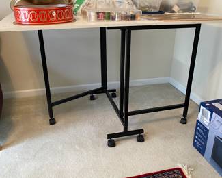 R102 - $100. Folding Sewing Table. Measures 60" x 36" 34" tall.