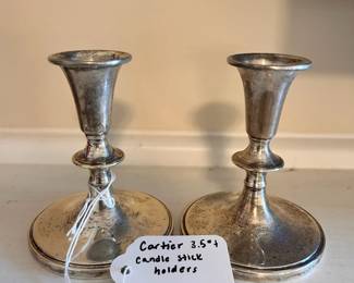 R136 - $60. Cartier Sterling Weights Candle Stick Holders $160. Measures 3.5" tall.