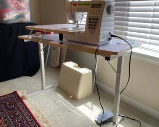 R99 - $225. Sewing Machine & Table. Smart by Pfaff. Model 200c. Table measures 40" long x 20" deep x 39" tall.