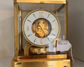 R151 - $275. Jager-Le Coultre Atmos Clock. Perpetual Motion 24kt gold plated Mantle Clock. Has personalized engraved plate at the bottom from 1976. Measures 9.25" tall x 8.25" wide x 6.5" deep.