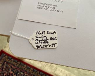 R99 - $225. Sewing Machine & Table. Smart by Pfaff. Model 200c. Table measures 40" long x 20" deep x 39" tall.