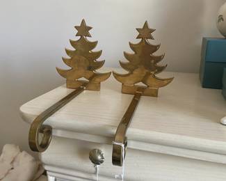 R79 - $30. Pair of Brass Stocking Holders.