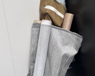 Lots of raw silk fabric on bolts Greys blues and more