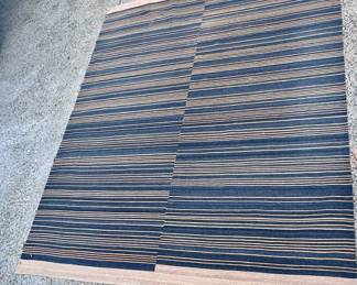 Wool black and beige or could be really dark navy large area rug.
