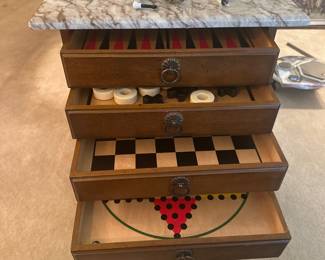 Game table. 4 drawers with different games. Marble top.