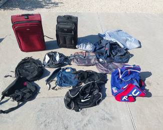 assorted backpacks, suitcases, bags