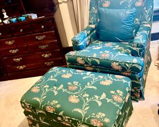 Pair of floral easy chairs and ottomans