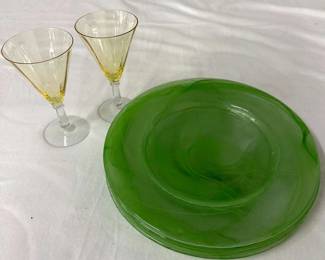 Pair of vintage cocktail glasses and set of four round, glass plates with a swirled green design