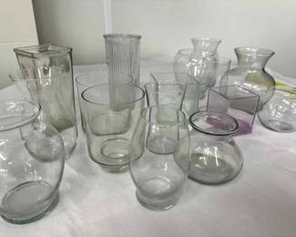 Collection of clear glass vases of various shapes and sizes