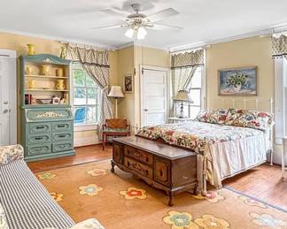 Iron bed, blue secretary, side tables, lamps, sofa, nice chest