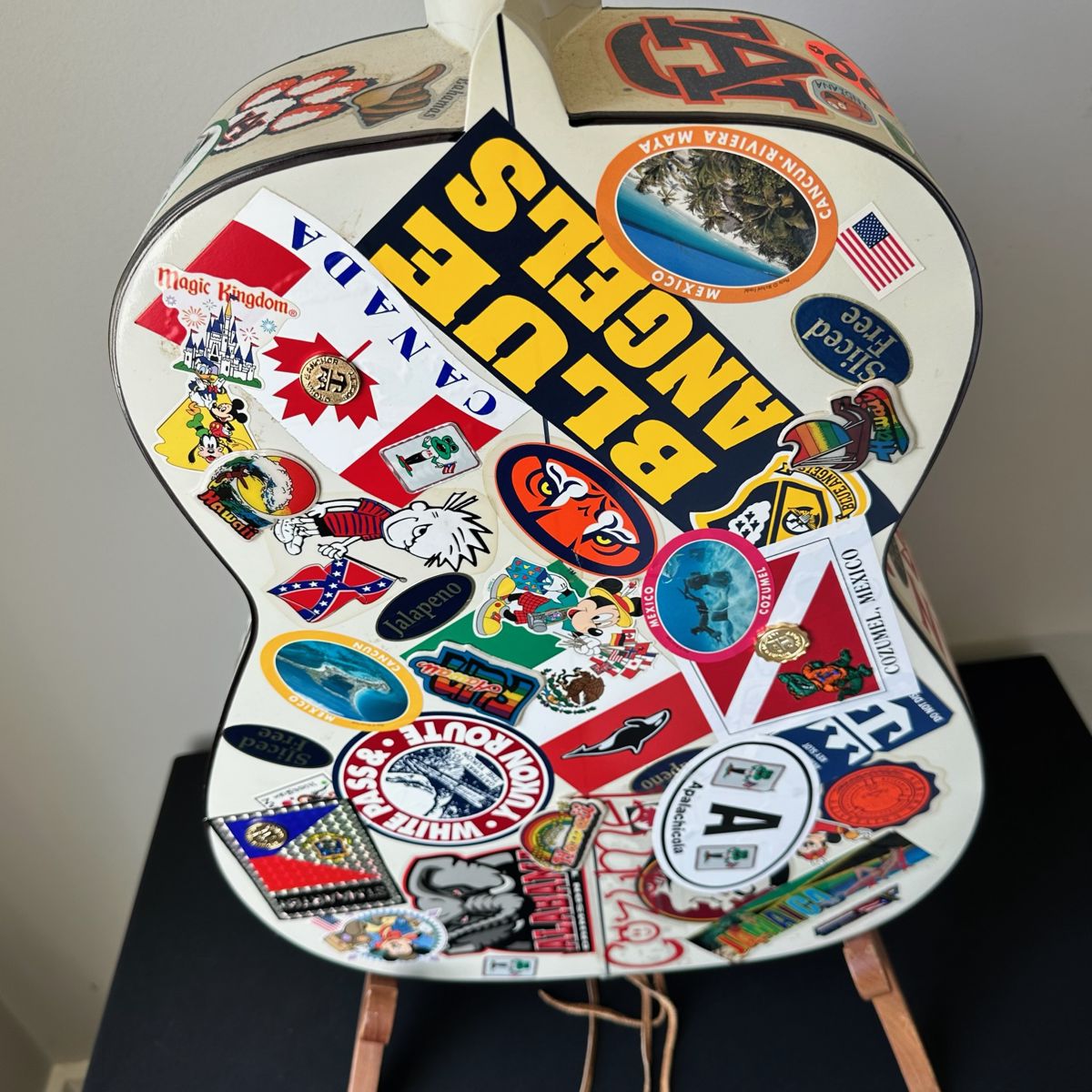 “Cruise Ship Guitar” Jim would take this on his cruises and gather the sticker-memories