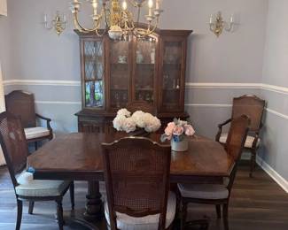 Dining table can set 8 or more with additional leaves, Cane back chairs