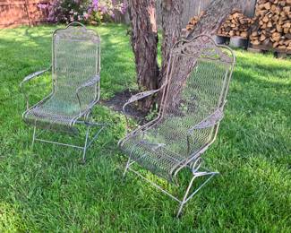 Pair of wrought iron rocker chairs