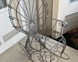 Wrought iron rocking chair/pot stand
