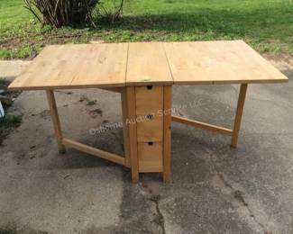 Drop leaf table with 6 drawers