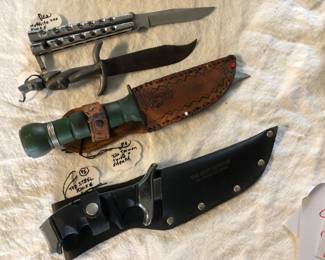 Top to bottom: Hoffritz steel knife. Figural one piece knife. Two steel knives with sheaths.