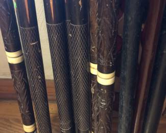 Close up of pool cues.