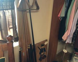 Vintage pool cues with ball collectors