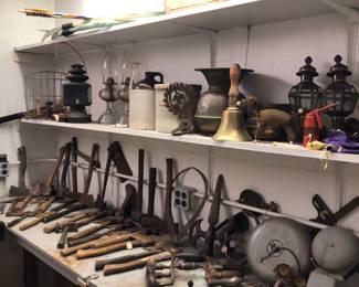 Overload of old axes, hatchets, hammers. Saws. Nice selection for collectors.