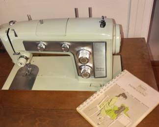Kenmore Sewing Machine and instruction book.
