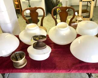 (2) Medium Schoolhouse Glass Globes
(4) 14"w • 12"h Large Milk Glass Globes circa 1920s as similar, if not the exact lights from the Vanity Arcade 114 S. Tennessee Avenue Lakeland Florida.