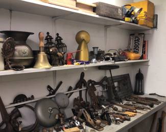 Old tools. Planers, hand drills, bits, wrenches, screw drivers, old school bell, ice tongs, interesting. Rust is free.