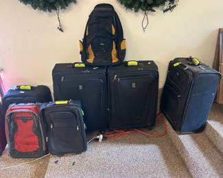 Lots of luggage , rugs, brass