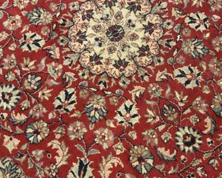 Round red and beige rug diameter: 50” $100 + tax