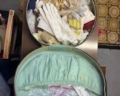 golden era round suitcase hat box full of vintage gloves