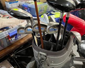 Ping golf clubs and Ping golf bag. G-10 Driver, G2 Irons 3-sandwedge. 8 irons total. 4 iron is missing...sorry, V-steel fairway woods and TaylorMade rescue woods. Scotty Cameron putter. Vokey wedge.