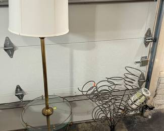 Floor lamp and wine bottle holder.