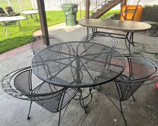 Wrought Iron patio table w/ 4 chairs.