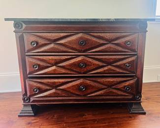 Neoclassical-style commode with a modern marble top.
