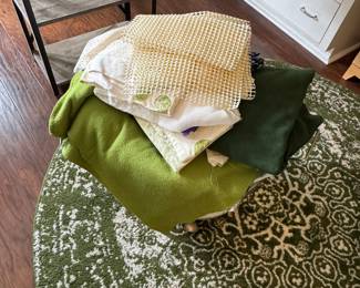 Round rug. Lots of pieces of material for art projects