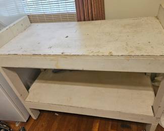 Great solid piece!! with a coat of paint, would make a great kitchen island or laundry room folding station!!