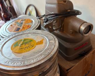 . . . vintage slide projector and film tins