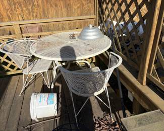 . . . wrought iron table and chairs