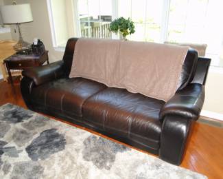 Raymour and Flanigan chocolate brown reclining sofa