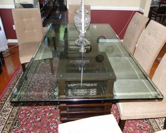 Glass top Dining Room table & 8 chairs. Table weighs 350 pounds needs 4 people to move it!