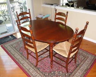 Hitchcock Kitchen table and 4 cane seat chairs, table has two additional leaves