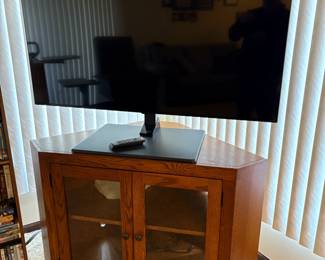 . . . flat-screen TV and a nice corner TV stand