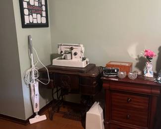 . . . antique oak sewing machine and newer Singer sewing machine