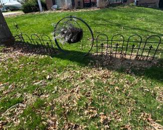 Cauldron and metal fence