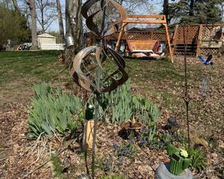 swirly art & wood swing in background